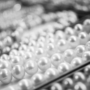 A close-up view of elegant pearl necklaces showcasing their shine and texture.